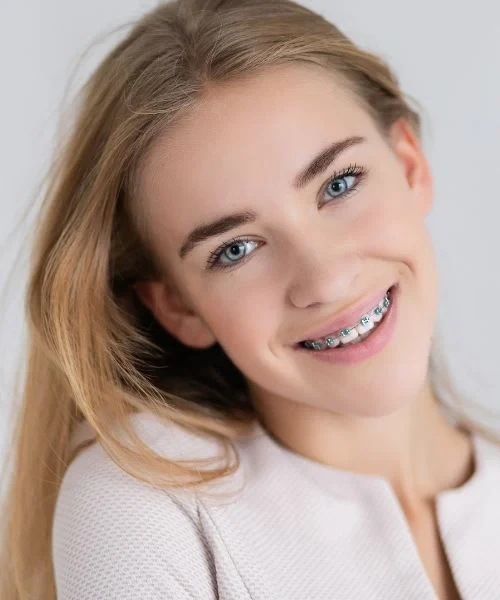 A patient wearing metal braces